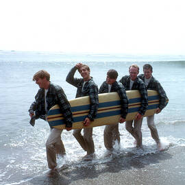 Beach Boys On The Beach With A Surfboard #1 Art Print by Michael