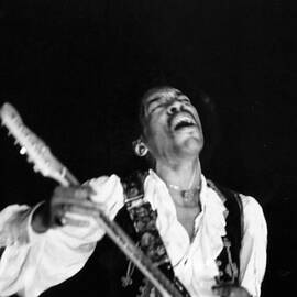 Jimi Hendrix Performs At Monterey by Michael Ochs Archives