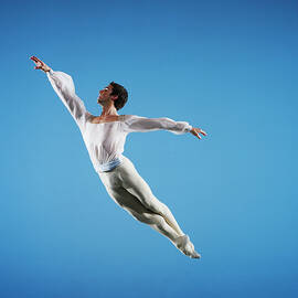 Male Ballet Dancer Leaping On Stage by Thomas Barwick