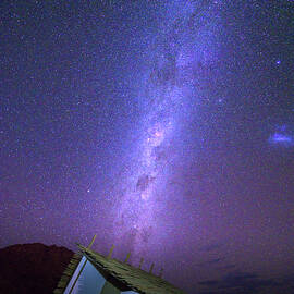 Milky way over a small chalet of a desert lodge near Sossusvlei in Namibia by Miroslav Liska
