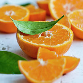 Oranges With Leaves, Whole, Halved And Slices by Ryla Campbell