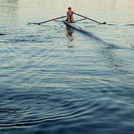 People Rowing Sculling Boats On River by Blend Images pete Saloutos