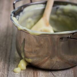 Remains Of Homemade Vanilla Pudding In A Pan by Esther Hildebrandt