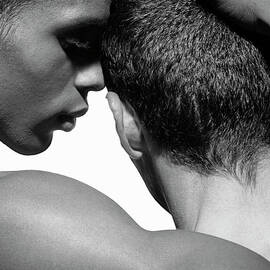 Two Naked Young Men Embracing, Close-up by Ed Freeman