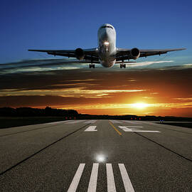Xl Jet Airplane Landing At Sunset by Sharply done