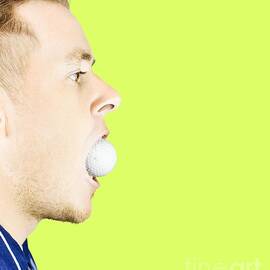Man with golf ball in mouth by Jorgo Photography