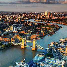 United Kingdom, England, London, Great Britain, Thames, City Of London, Tower Bridge, Aerial View Of The Tower Bridge And Canary Wharf At Sunset by Maurizio Rellini