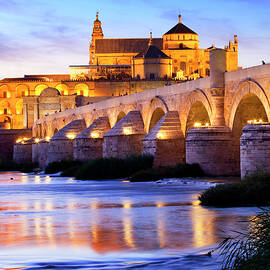 Spain, Andalusia, Cordoba, La Mezquita Cathedral, The Cathedral And Former Great Mosque Of Cordoba (mezquita De Cordoba) And Roman Bridge (puente Romano) Over The Guadalquivir River by Luigi Vaccarella