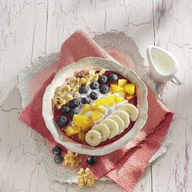 A Banana And Acai Berry Smoothie Bowl by Karl Newedel