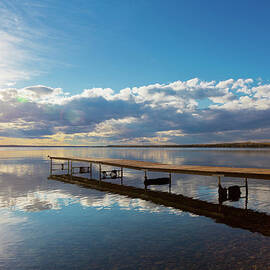 A Dock Leading Out Into The Lake At by Steve Nagy Design Pics
