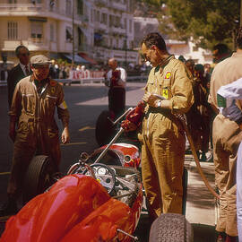 A Ferrari Team Member Filling A Car by Heritage Images