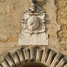A Historic Coat Of Arms Above An Archway In The Town Of Pitigliano tuscany, Italy by Anthony Lanneretonne