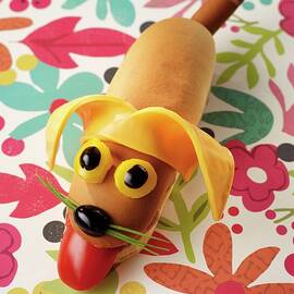 A Hot Dog With A Smiling Dog's Face by Caspar Carlott