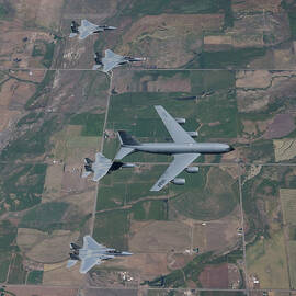 A Kc-135r Stratotanker Refuels Four by High-g Productions stocktrek Images