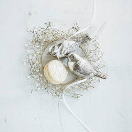 A Macaroon With Silver Christmas Decorations by Eising Studio