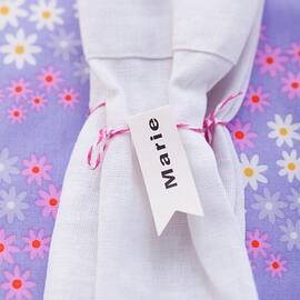 A Napkin Wrapped With Kitchen String And With A Name Label by Eising Studio - Food Photo & Video