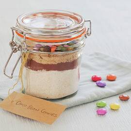 A Preserving Jar Containing The Dry Ingredients For Making Chocolate Biscuits With Chocolate Beans by Lowe, Cath