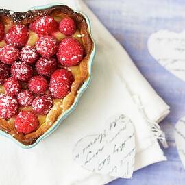 A Raspberry Tart In A Heart-shaped Baking Tin by Carine Lutt