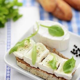 A Slice Of Bread Topped With Soft Cheese by Caste, Alain