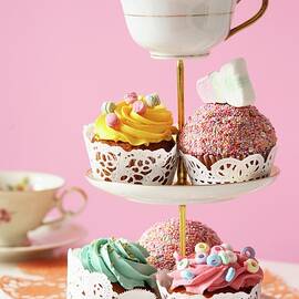 An Assortment Of Cupcakes And Marshmallows On A Tiered Cake Stand by Fröhlich, Heidi