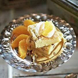 Blondies With Cream And Orange Fillets by Hannah Kompanik