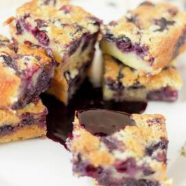 Blueberry Cake Slices With A Chocolate Sauce by Kevin Buch