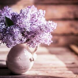 Bouquet Of Lilac Against Wooden Background by Alena Haurylik