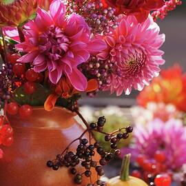 Bouquet Of Red Dahlias With Sprig Of Berries In Vase by Angelica Linnhoff