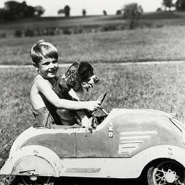 Boy Driving Toy Car, With Springer by H. Armstrong Roberts