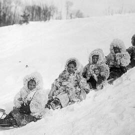 Canadian Indian Children On Sled by Bettmann