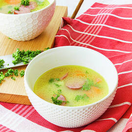 Carrot And Potato Stew With Sausage Slices by Jo Kirchherr