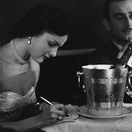 Champagne On Table by Kurt Hutton
