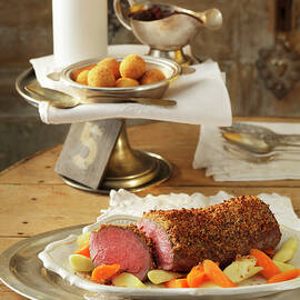 Chateaubriand Steak With Gingerbread Crust, Vegetables, Sauce And Croquettes On Table by Jalag / Götz Wrage
