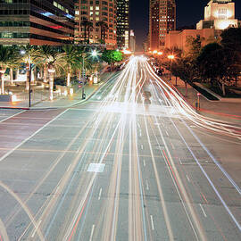 City Light Trails On Street In Downtown by Eric Lo