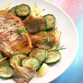 Close-up Of Veal Chops With Courgettes On Dish by Jalag / Uwe Bender