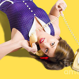 Cool pin-up girl making conversation on telephone by Jorgo Photography