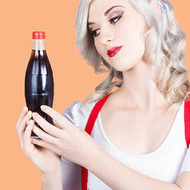 Cute pin up girl with soda bottle. Vintage cafe by Jorgo Photography