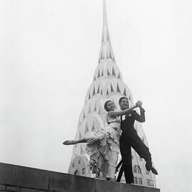 Dancing By The Chrysler Building by Bettmann