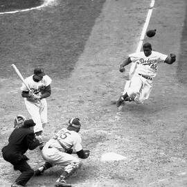 Dodger Jackie Robinson Stealing Home by Bettmann