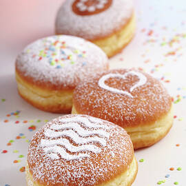 Doughnuts For Carnival With Various Icing Sugar Patterns by Teubner Foodfoto
