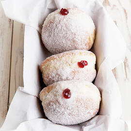 Doughnuts With Strawberry Jam And Powdered Sugar by Sylvia Meyborg