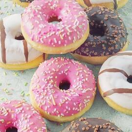 Doughnuts With Various Glazes And Sugar Sprinkles by Jan Wischnewski