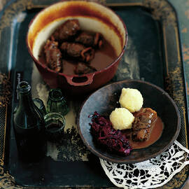 Dumplings Of Beef Roulade With Red Cabbage In Serving Dish by Jalag / Jan C. Brettschneider