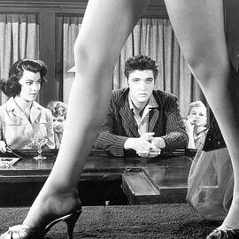 Elvis Presley Framed Between Womans Legs by Bettmann