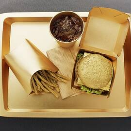 Fast Food With A Gold-coloured Disposable Food Set by Ellert, Luzia