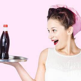 Fifties style female waiter serving up soda by Jorgo Photography