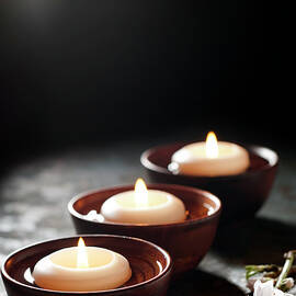Floating Candles In A Zen Background by Nightanddayimages