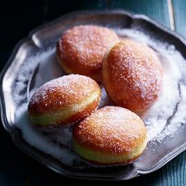 Four Jam Doughnuts On A Pewter Plate by Oliver Brachat