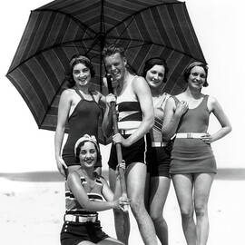 Four Women And One Man Under Beach by H. Armstrong Roberts