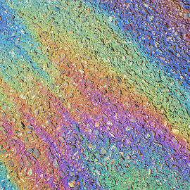Gasoline Spilled On A Road Surface by Rob Atkins